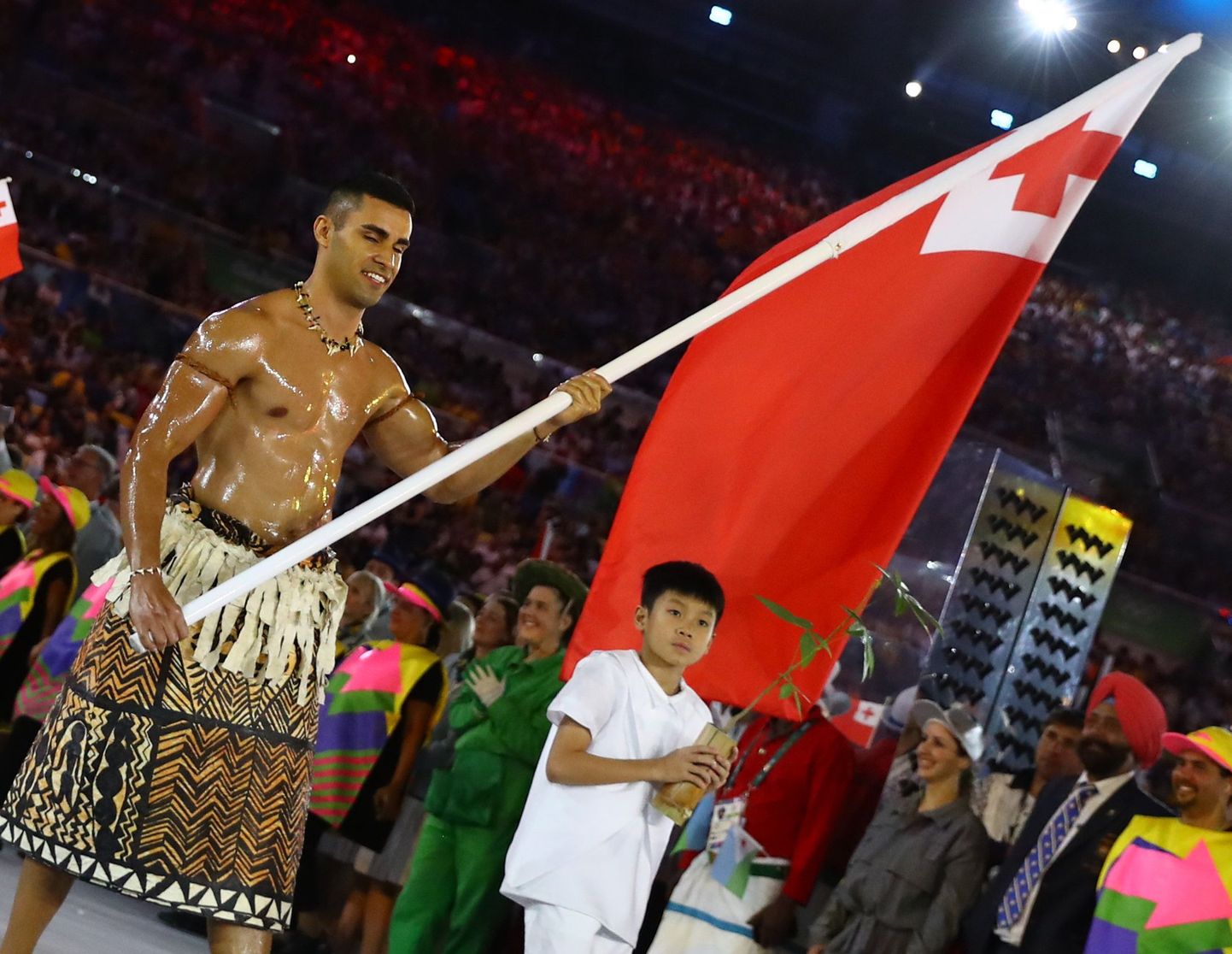 2016 Rio Olympics - Opening Ceremony - Maracana - Rio de Janeiro, Brazil - 05/08/2016. Flagbearer Pita Nikolas Taufatofua (TGA) of Tonga leads his contingent during the opening ceremony.    REUTERS/Kai Pfaffenbach  FOR EDITORIAL USE ONLY. NOT FOR SALE FOR MARKETING OR ADVERTISING CAMPAIGNS.
