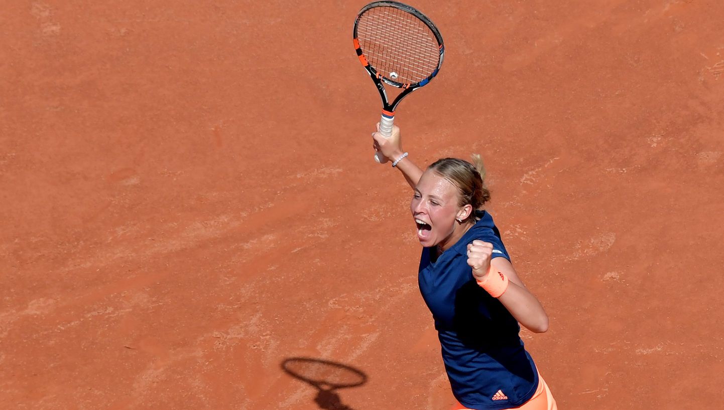 Estonia's Anett Kontaveit celebrates after winning the match against Angelique Kerber of Germany during the WTA Tennis Open tournament at the Foro Italico, on May 17, 2017 in Rome.  / AFP PHOTO / TIZIANA FABI