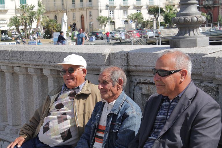 Angelo, Giuseppe and Enzo, natives of Sicily, want nothing to do with the migrants.