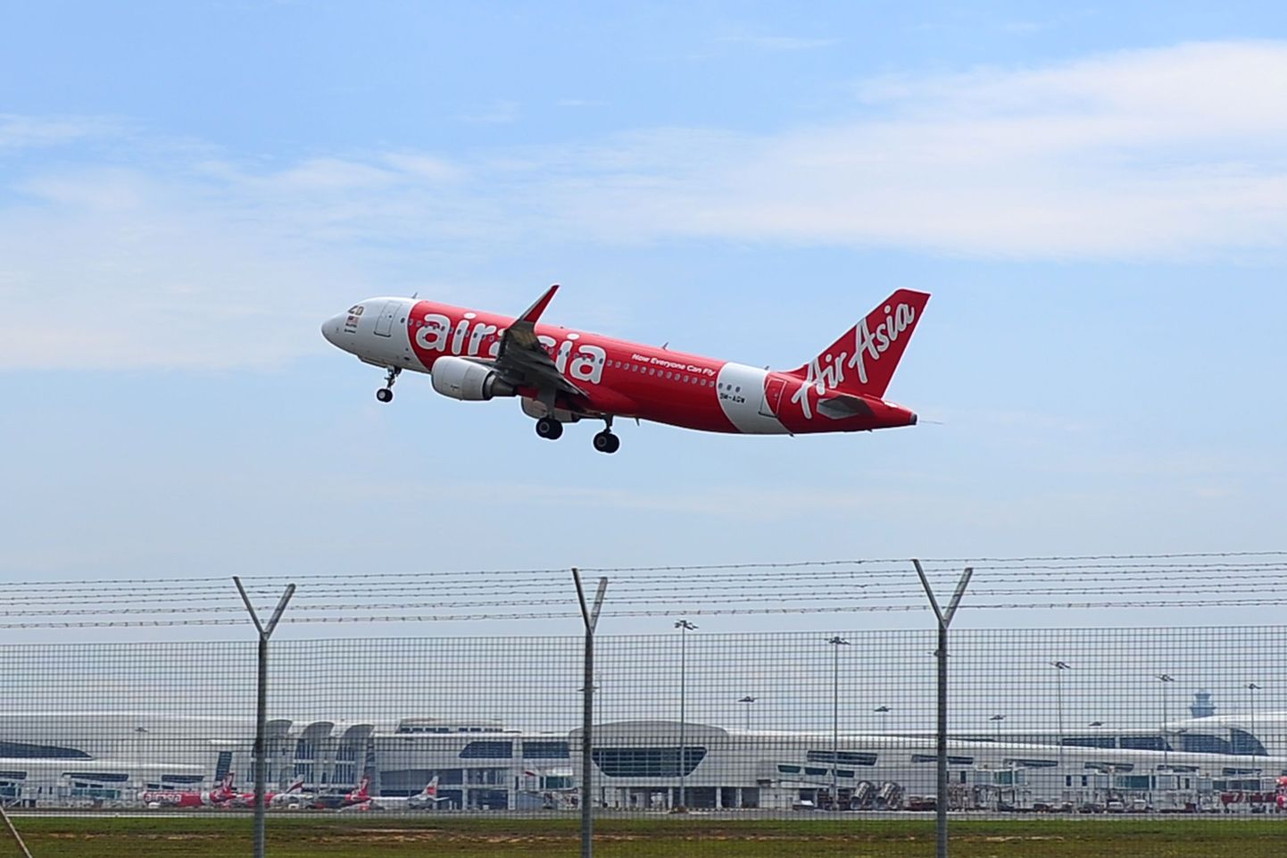 In this May 9, 2014 photo, an Air Asia A320-200 plane takes off from Kuala Lumpur International Airport 2 in Sepang, Malaysia. An AirAsia plane with 161 people on board lost contact with ground control on Sunday, Dec. 28, 2014,  while flying over the Java Sea after taking off from a provincial city in Indonesia for Singapore, and search and rescue operations were underway.  AirAsia, a regional low-cost carrier with presence in several Southeast Asian countries, said in a statement that the missing plane was an Airbus A320-200 and that search and rescue operations were in progress. The plane in this photo is the same model but not the one which went missing in Indonesia Sunday.  (AP Photo/Joshua Paul)