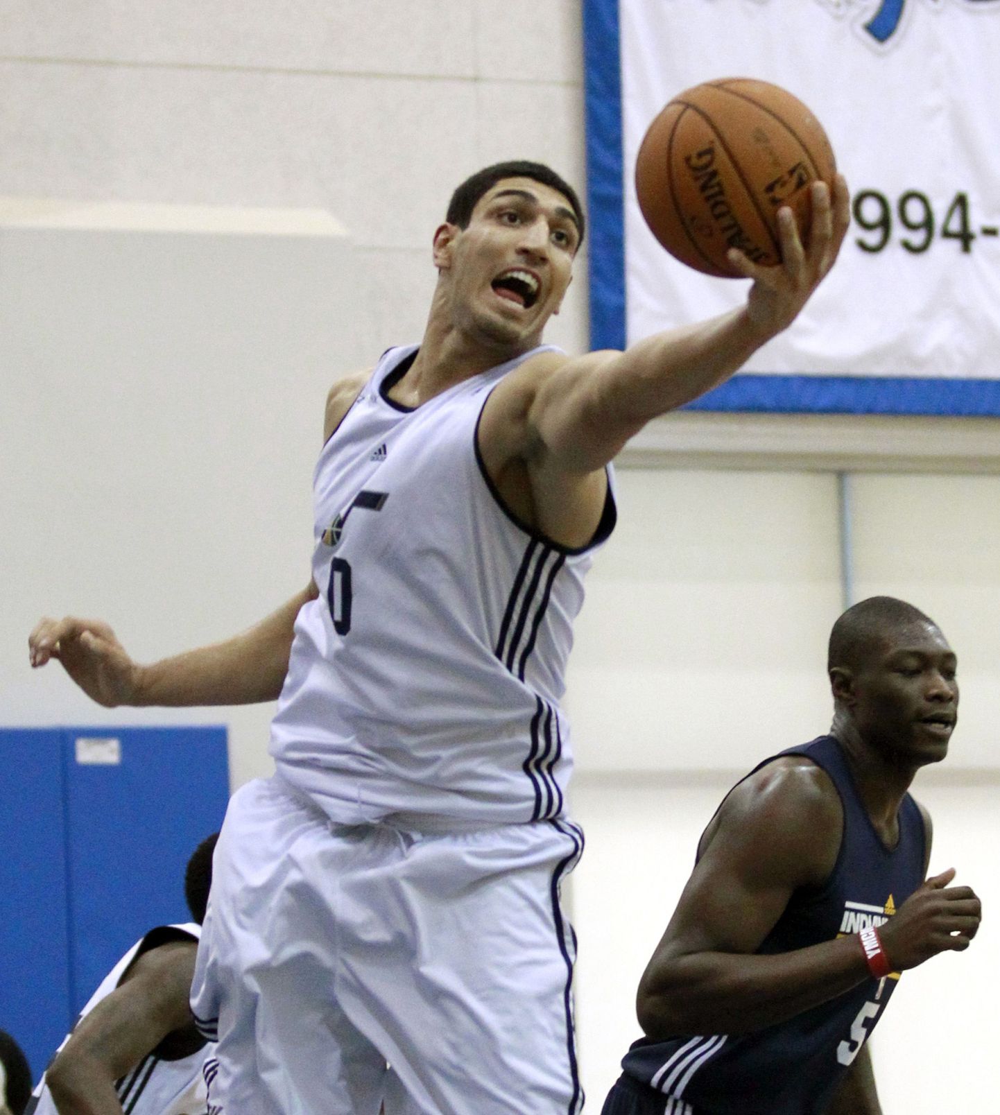 Utah Jazz's Enes Kanter, left, grabs a rebound in front of Indiana Pacers' Hamady N'diaye (5) during an NBA summer league basketball game, Thursday, July 12, 2012, in Orlando, Fla. (AP Photo/John Raoux)  / SCANPIX Code: 436