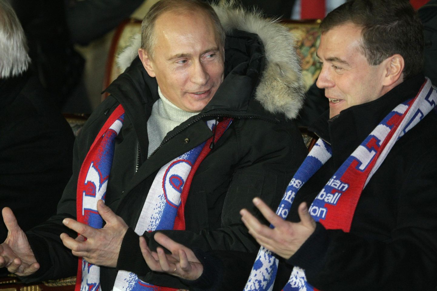 Премьер-министр РФ Владимир Путин и президент РФ Дмитрий Медведев на трибуне стадиона во время матча сборной России.