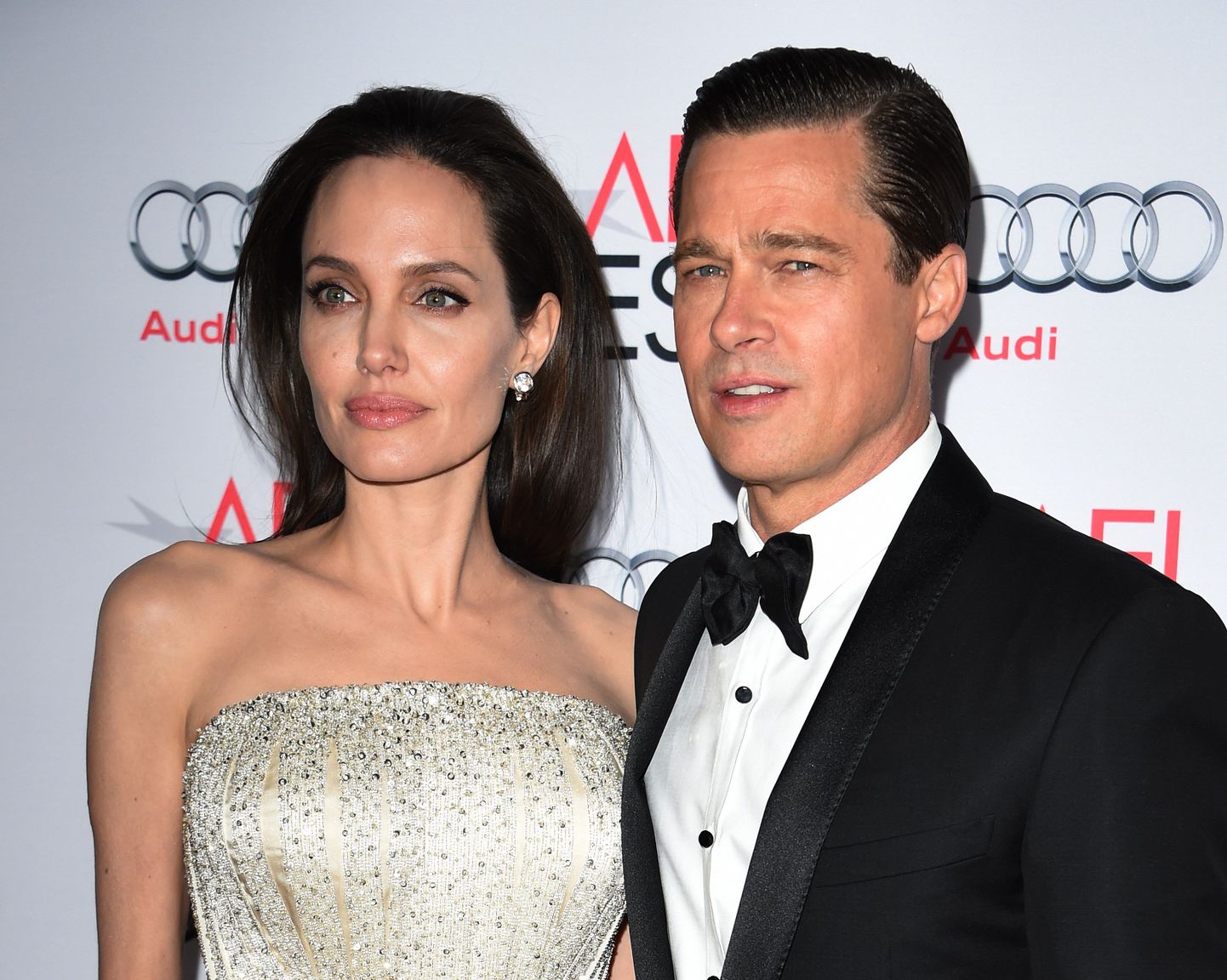 Writer-director-producer-actress Angelina Jolie Pitt (L) and actor-producer Brad Pitt arrive for the opening night gala premiere of Universal Pictures' 'By the Sea' during AFI FEST 2015 presented by Audi at the TCL Chinese Theatre in Hollywood, California on November 5, 2015.         AFP PHOTO / MARK RALSTON