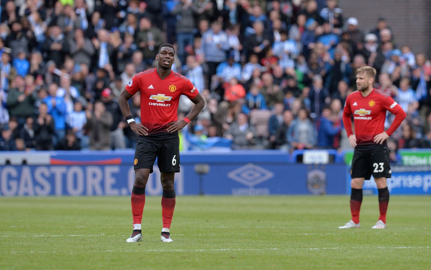 Soccer Football - Premier League - Huddersfield Town v Manchester United - John Smith's Stadium, Huddersfield, Britain - May 5, 2019  Manchester United's Paul Pogba and Luke Shaw look dejected during the match       REUTERS/Peter Powell  EDITORIAL USE ONLY. No use with unauthorized audio, video, data, fixture lists, club/league logos or "live" services. Online in-match use limited to 75 images, no video emulation. No use in betting, games or single club/league/player publications.  Please contact your account representative for further details.