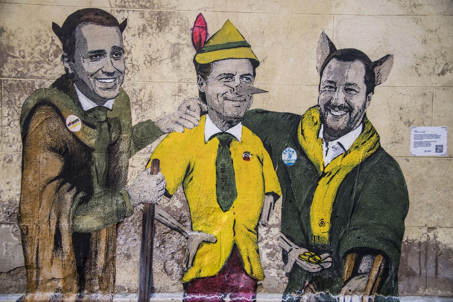 Seinamaaling, mis kujutab Viie Tähe Liikumise juhti Luigi Di Maiot (vasakult), Itaalia peaministrit Giuseppe Contet ja Põhjaliiga liidrit Matteo Salvinit muinasjututegelastena.