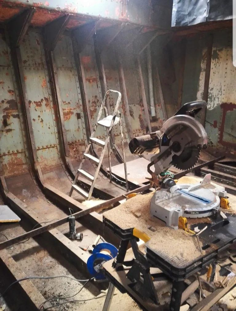 Pic by Caters News - (Pictured: The boat while it was being worked on by