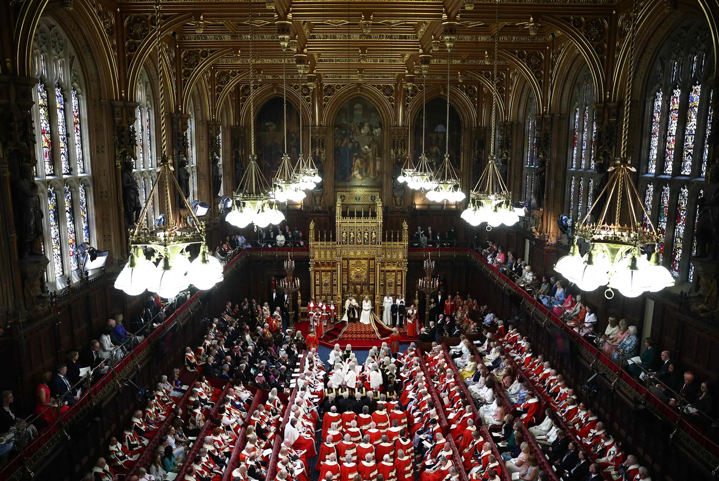 Britain's King Charles III, wearing the Imperial State Crown and the Robe of State, reads the King's Speech from the The Sovereign's Throne in the House of Lords chamber, during the State Opening of Parliament, at the Houses of Parliament, in London, on July 17, 2024. (Photo by HENRY NICHOLLS / POOL / AFP)