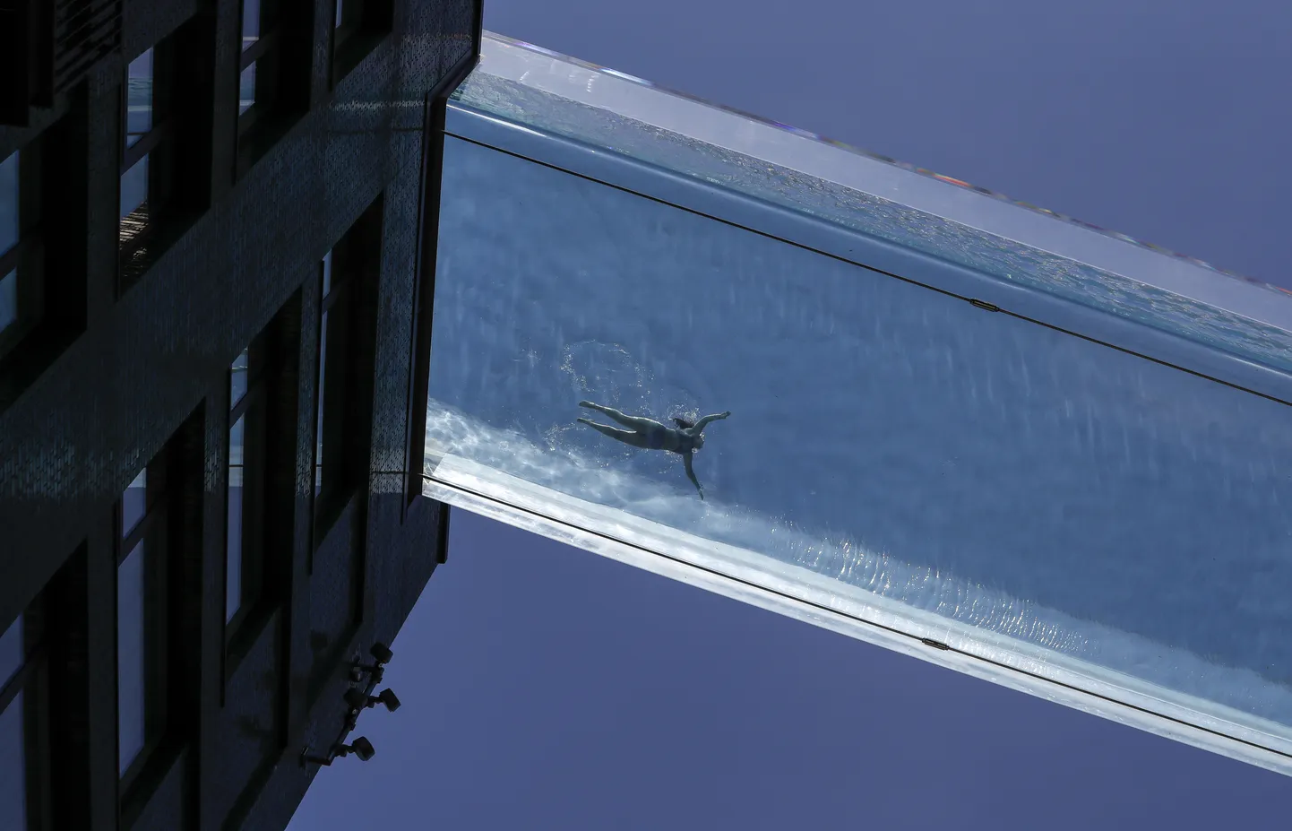 LONDON, June 3, 2021  A person swims in the Sky Pool, a transparent swimming pool bridge across two residential blocks in south London, Britain, on June 2, 2021. (Credit Image: Â© Han Yan/Xinhua via ZUMA Press)