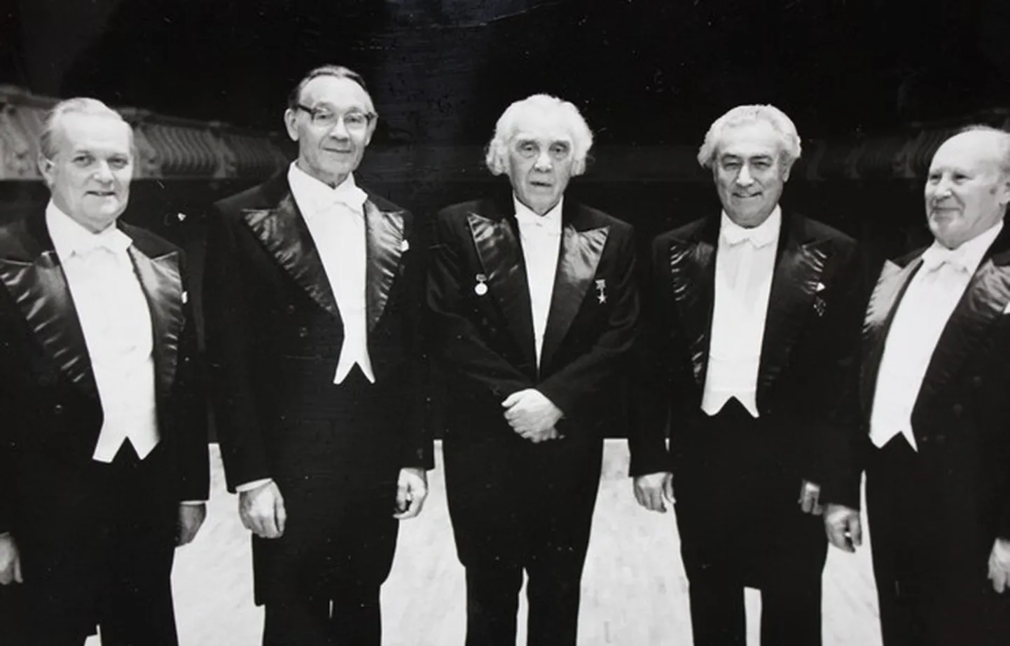 Pildil RAMi koorinõukogu 1984. aastal 2. novembril. Rudolf on vasakult teine ning paremal tema kõrval seisab koorijuht Gustav Ernesaks.