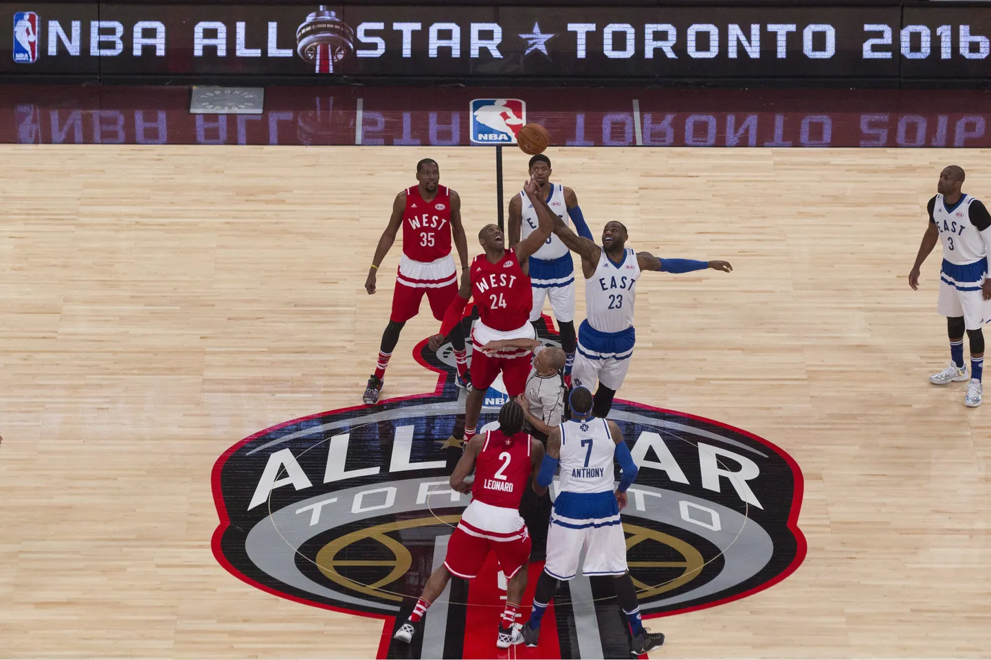 Western Conference's Kobe Bryant, of the Los Angeles Lakers, (24) and Eastern Conference's LeBron James, of the Cleveland Cavaliers (23) compete for the tip off to start NBA All-Star Game basketball action in Toronto on Sunday, February 14, 2016. THE CANADIAN PRESS/Chris Young