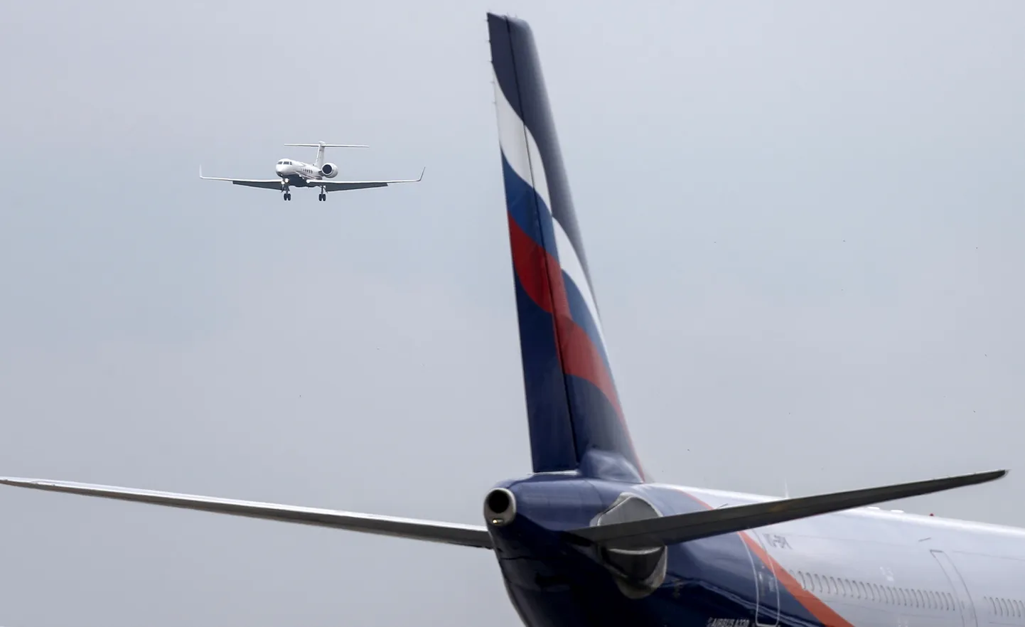 FILE PHOTO: An Aeroflot aircraft (front) is seen at Sheremetyevo International Airport outside Moscow, Russia, July 7, 2015. REUTERS/Maxim Shemetov/File Photo