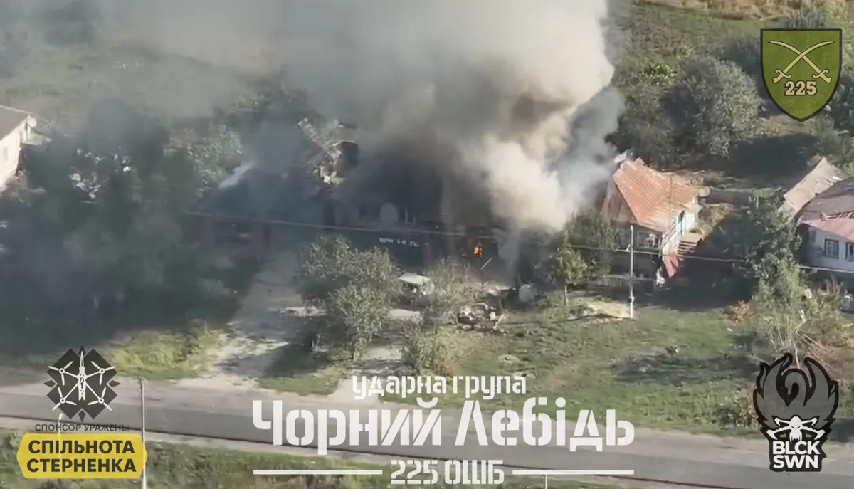 An aerial view shows smoke erupting from a Russian building on fire following a Ukrainian military operation in Korenevo, Kursk Region, Russia.