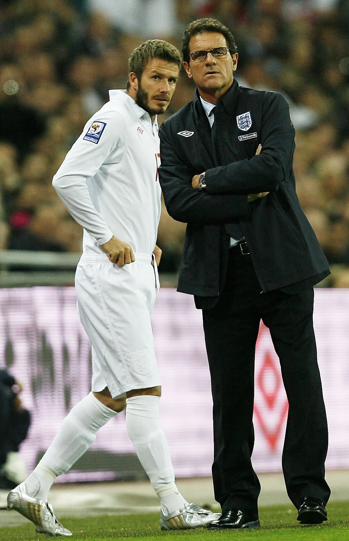 David Beckham (vasakul) ja Fabio Capello.