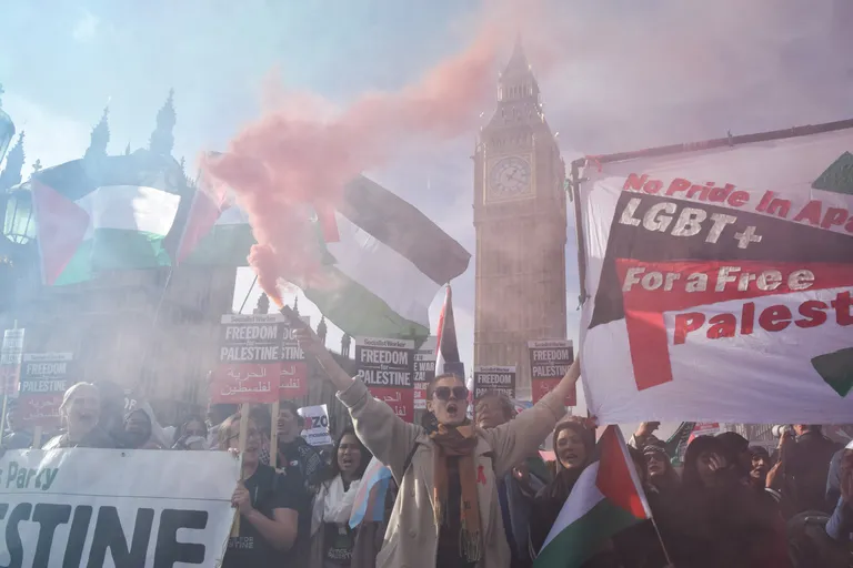 October 28, 2023, London, England, UK: Members of the LGBT community show their support on Westminster Bridge. Tens of thousands of people marched in central London in solidarity with Palestine as the Israel-Hamas war intensifies. 