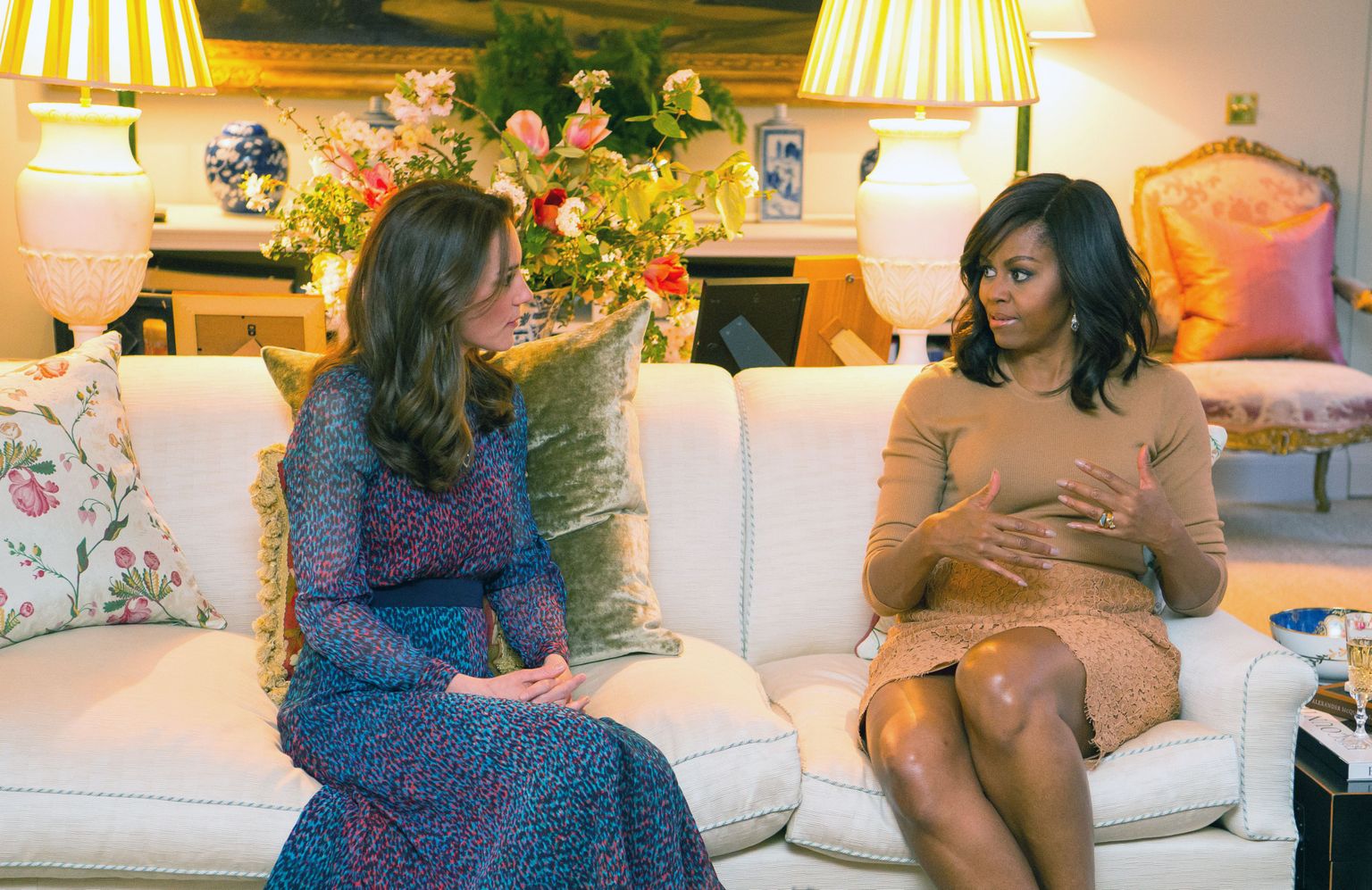 Britian's Kate Duchess of Cambridge talks with US first lady Michelle Obama, right, in the Drawing Room of Kensington Palace, London, prior to a private dinner hosted by Prince William and Kate, Friday April 22, 2016.  US President Barack Obama and Michelle plunged into a whirlwind visit to England with royal socializing and political talks. (Dominic Lipinski/Pool via AP)
