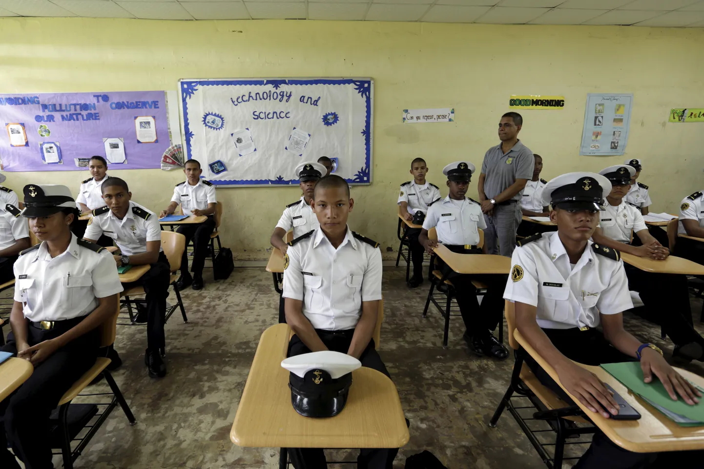 Year 10 high school students from a vocational program with a maritime focus pose for a photograph at Artes y Oficios Melchor Lasso de la Vega school in Panama City, September 4, 2015. Nearly three years after Taliban gunmen shot Pakistani schoolgirl Malala Yousafzai, the teenage activist last week urged world leaders gathered in New York to help millions more children go to school. World Teachers' Day falls on 5 October, a Unesco initiative highlighting the work of educators struggling to teach children amid intimidation in Pakistan, conflict in Syria or poverty in Vietnam. Even so, there have been some improvements: the number of children not attending primary school has plummeted to an estimated 57 million worldwide in 2015, the U.N. says, down from 100 million 15 years ago. Reuters photographers have documented learning around the world, from well-resourced schools to pupils crammed into corridors in the Philippines, on boats in Brazil or in crowded classrooms in Burundi.    REUTERS/Carlos Jasso PICTURE 1 OF 47 FOR WIDER IMAGE STORY "SCHOOLS AROUND THE WORLD"SEARCH "EDUCATORS SCHOOLS" FOR ALL IMAGES
