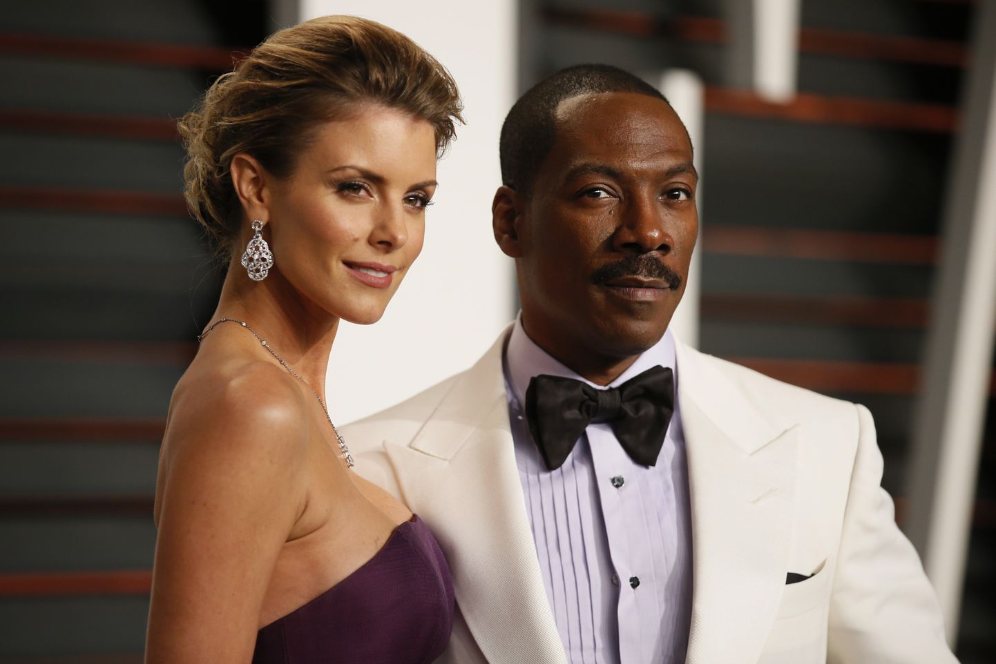 Comedian Eddie Murphy and Paige Butcher arrive at the 2015 Vanity Fair Oscar Party in Beverly Hills, California February 22, 2015.  REUTERS/Danny Moloshok (UNITED STATES  - Tags: ENTERTAINMENT) (VANITY FAIR-ARRIVALS)