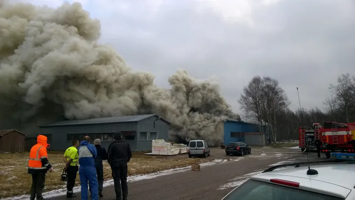 Burning fiberglass plastic factory emitting toxic smoke on Saaremaa Island
