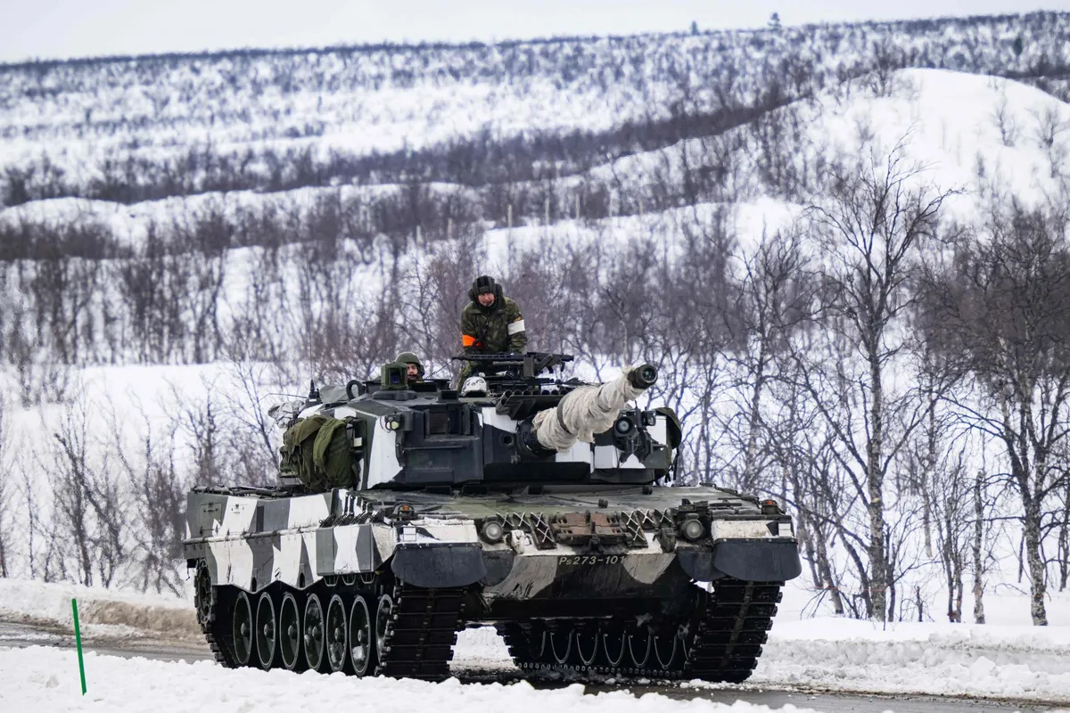Finnish soldiers of the Finnish-Swedish Division ride the Leopard 2A6 during a demonstration of border crossing by Swedish and Finnish troops as part of the NATO Nordic Response 24 military exercise on March 9, 2024.