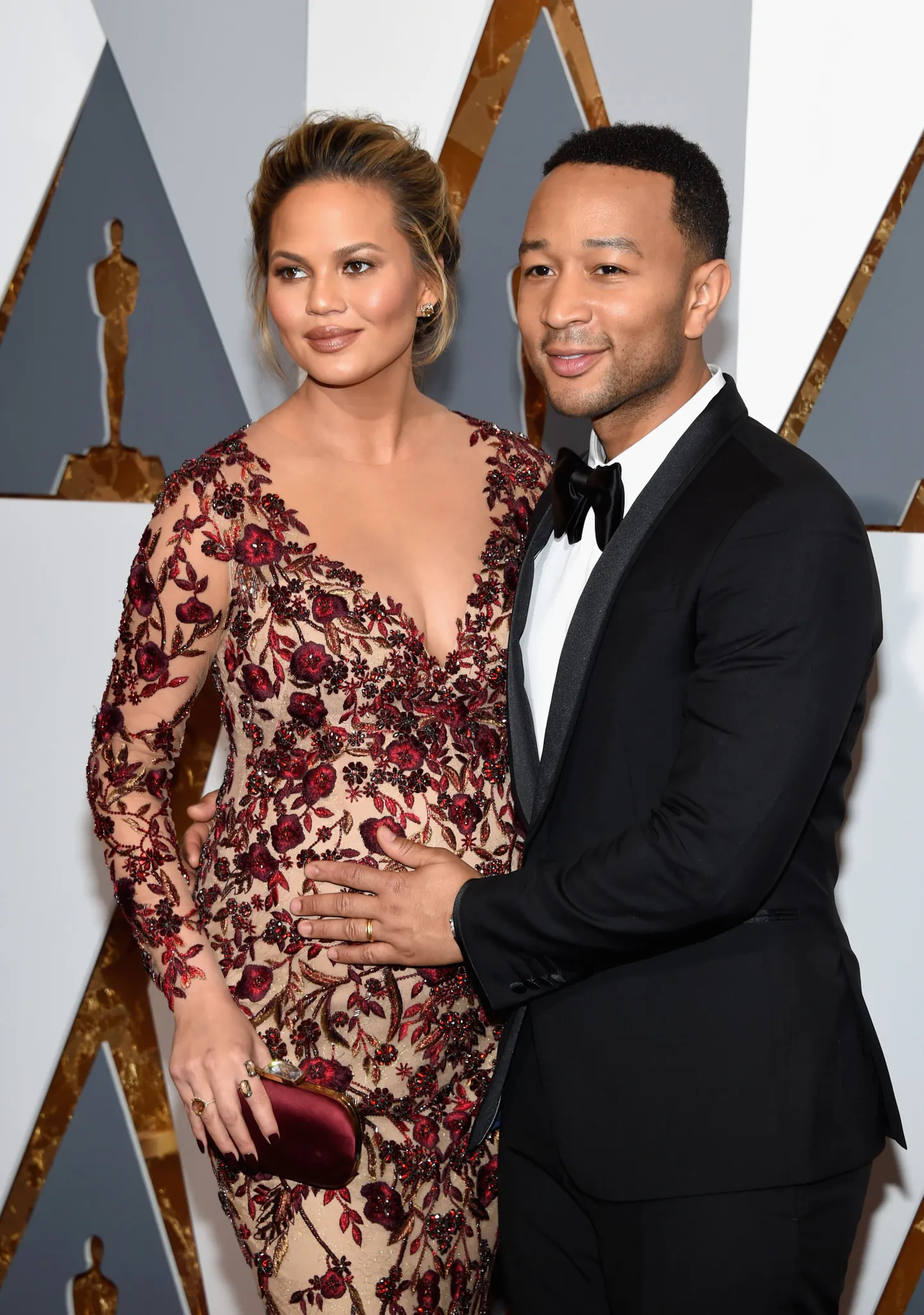 HOLLYWOOD, CA - FEBRUARY 28: Model Chrissy Teigen and musician John Legend attend the 88th Annual Academy Awards at Hollywood & Highland Center on February 28, 2016 in Hollywood, California.   Ethan Miller/Getty Images/AFP
== FOR NEWSPAPERS, INTERNET, TELCOS & TELEVISION USE ONLY ==