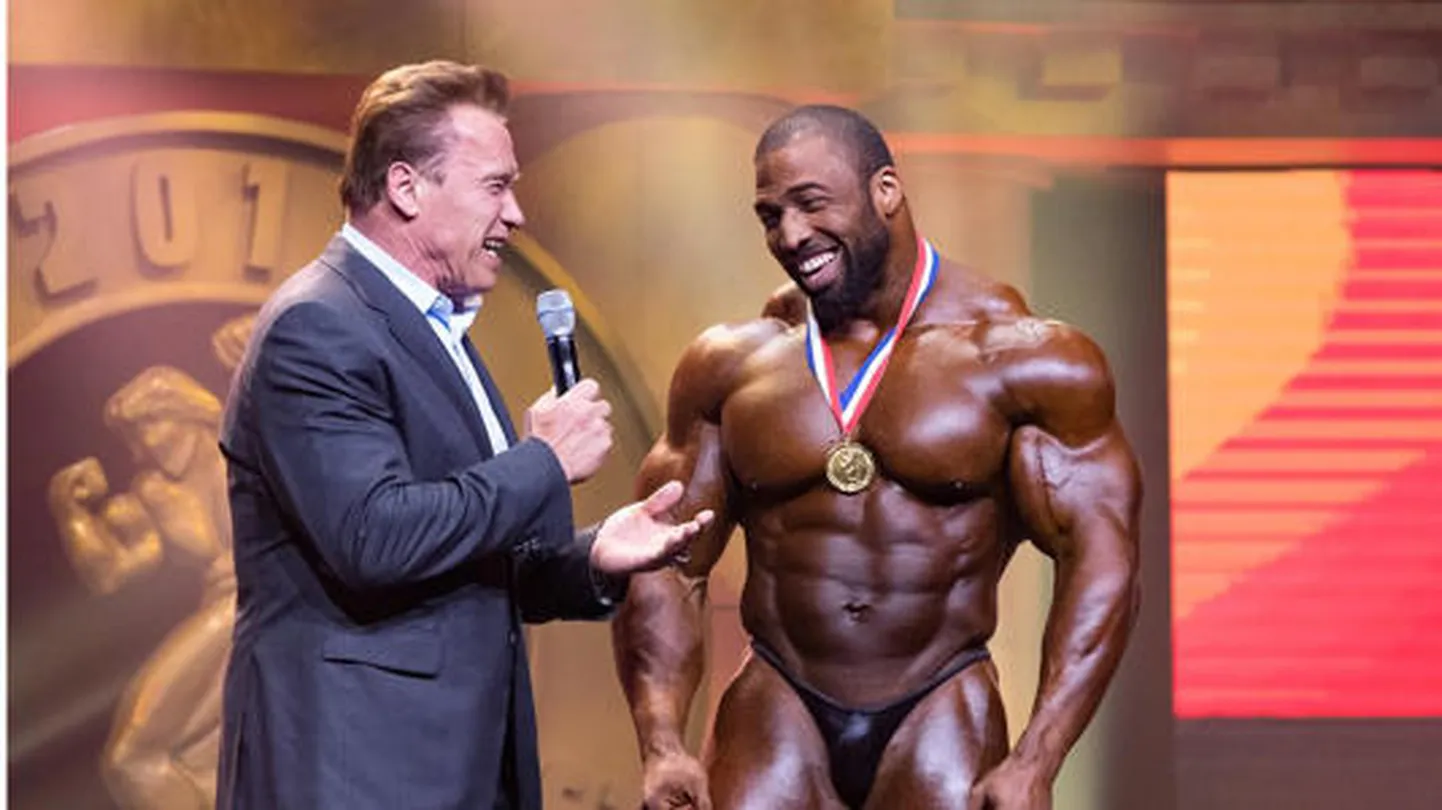 Arnold Schwarzenegger ja Cedric McMillan.