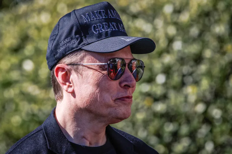 March 11, 2025, Washington, District Of Columbia, USA: Elon Musk, Tesla CEO and Senior Advisor to the President of the United States, looks on as United States President Donald Trump speaks in front of Tesla vehicles at the White House in Washington, D.C. on March 11, 2025. President Trump has said he will buy a Tesla to support Tesla and Elon Musk after recent attacks on Tesla charging stations and calls for boycotts of Tesla products (Credit Image: © Samuel Corum - Pool Via Cnp/CNP via ZUMA Press Wire)