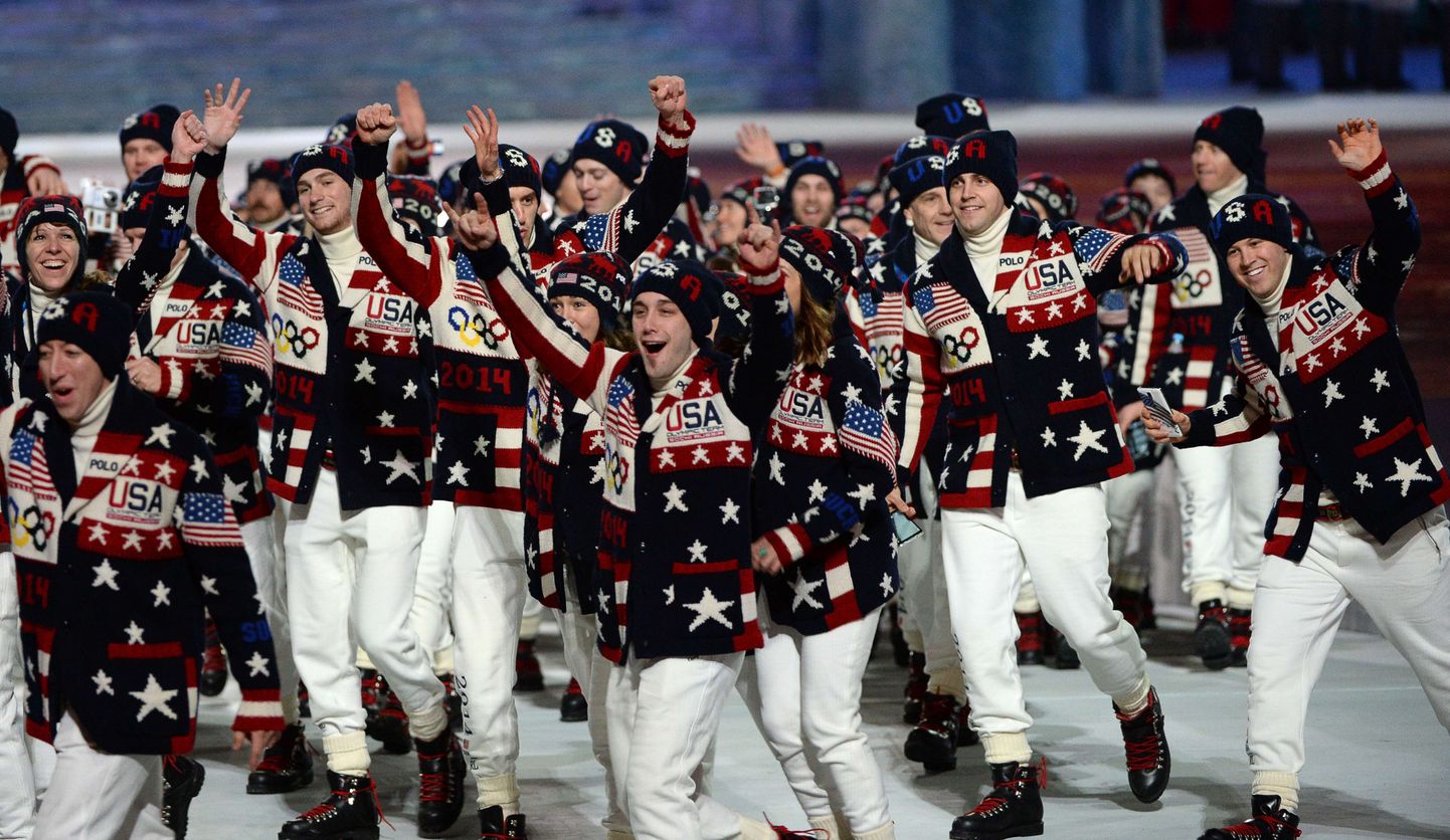 USA's delegation members wave during the Opening Ceremony of the Sochi Winter Olympics at the Fisht Olympic Stadium on February 7, 2014 in Sochi. AFP PHOTO / ANDREJ ISAKOVIC