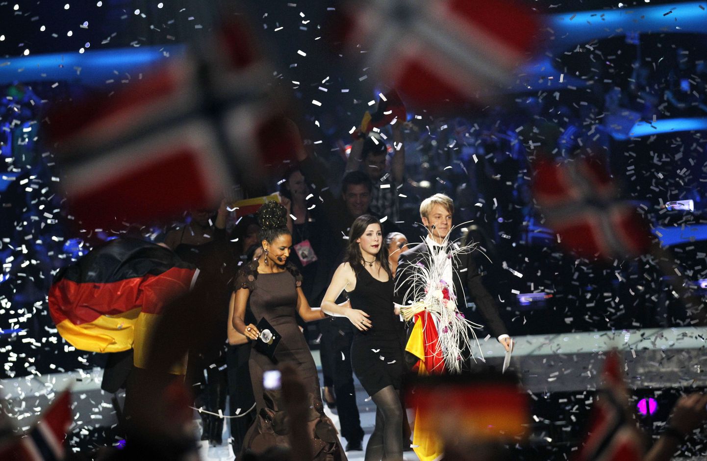 Germany's Lena (C) celebrates after winning the final of the Eurovision Song Contest 2010 at the Telenor Arena in Baerum, near Oslo, Norway, on May 29, 2010. The 55th annual competition was expected to be watched by more than 120 million viewers in 39 European countries.  AFP PHOTO / DANIEL SANNUM LAUTEN