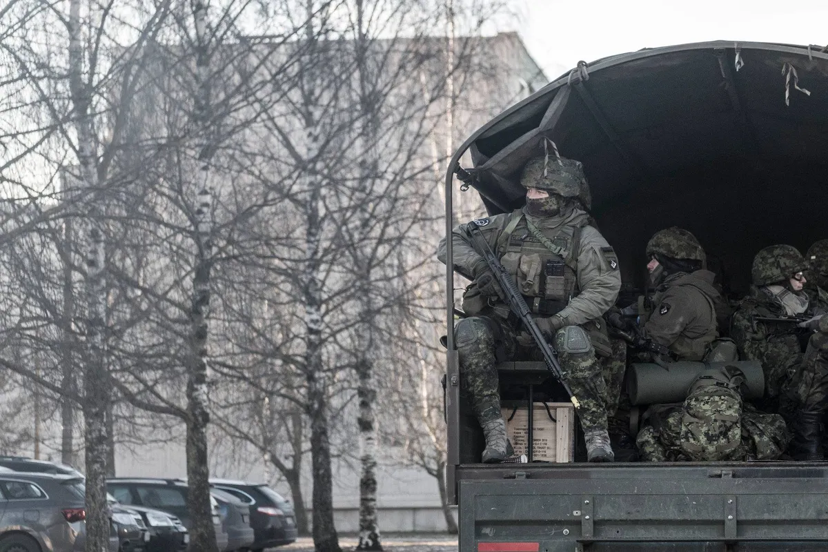 Educational psychologist Grete Arro (pictured sitting in a military truck, back on the right, smiling) is a credible critic of the military education system, having been an active member of the Estonian Defense League herself.