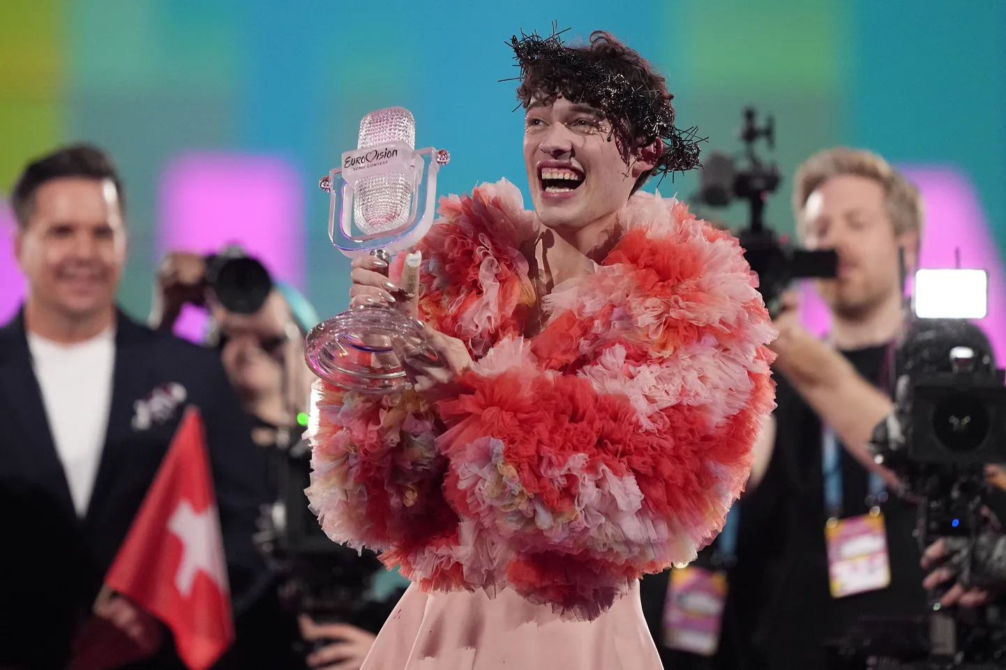 Nemo of Switzerland, who performed the song The Code, celebrates after winning the Grand Final of the Eurovision Song Contest in Malmo, Sweden, Sunday, May 12, 2024. (AP Photo/Martin Meissner)  TH264