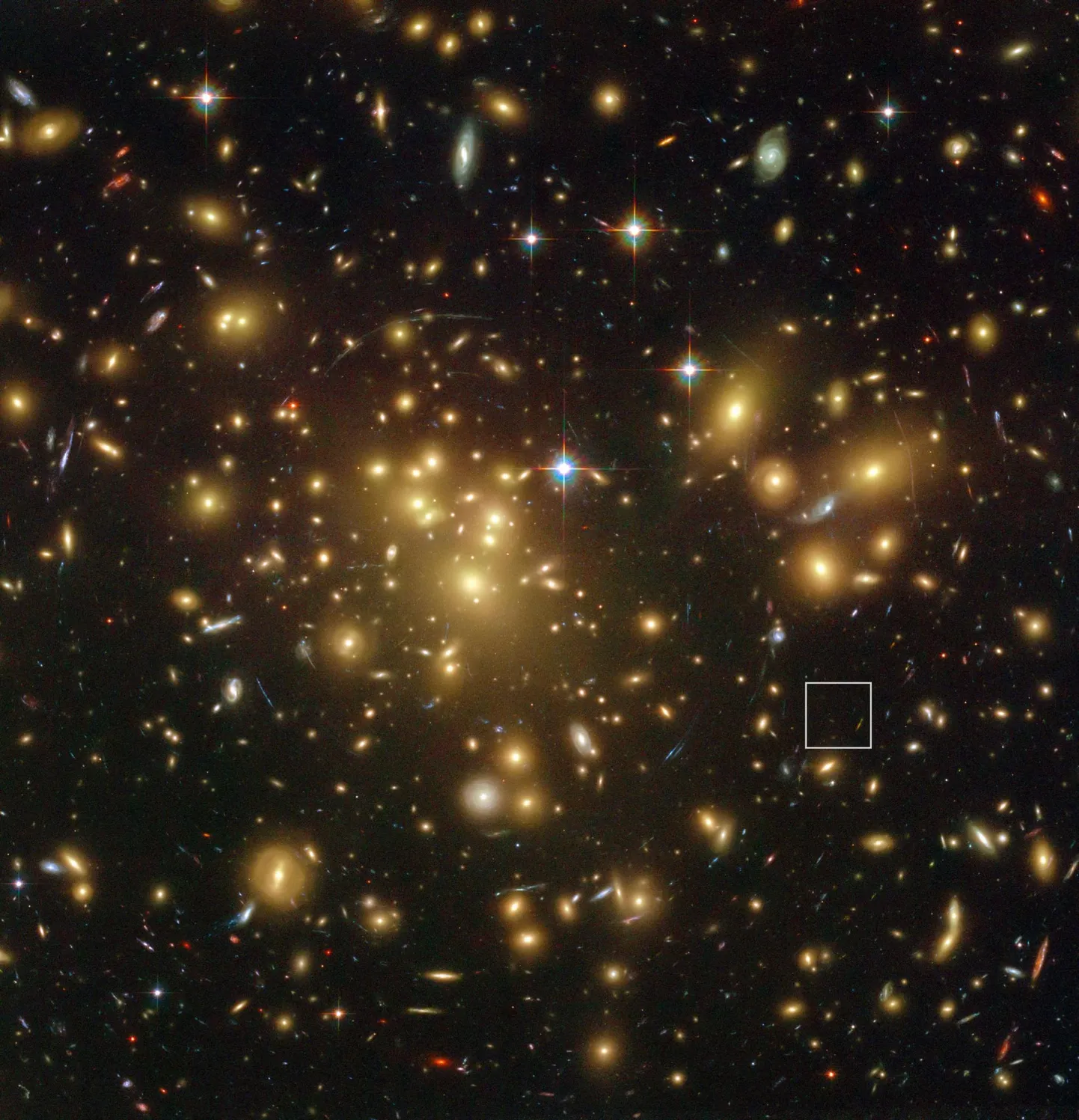 Galaktikaparv Abell 1689, mis asub meist 2,2 miljardi valgusaasta kaugusel. Sellesse kuulub üle 160 000 tähepilve. Ruudukese sees on galaktika A1689-zD1, mis on üks meist kõige kaugemal asuvaid galaktikaid - 13 miljardi valgusaasta kaugusel.