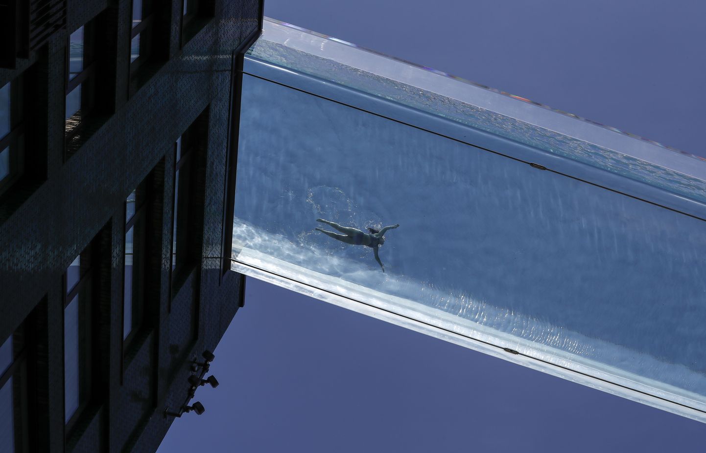 LONDON, June 3, 2021  A person swims in the Sky Pool, a transparent swimming pool bridge across two residential blocks in south London, Britain, on June 2, 2021. (Credit Image: Â© Han Yan/Xinhua via ZUMA Press)