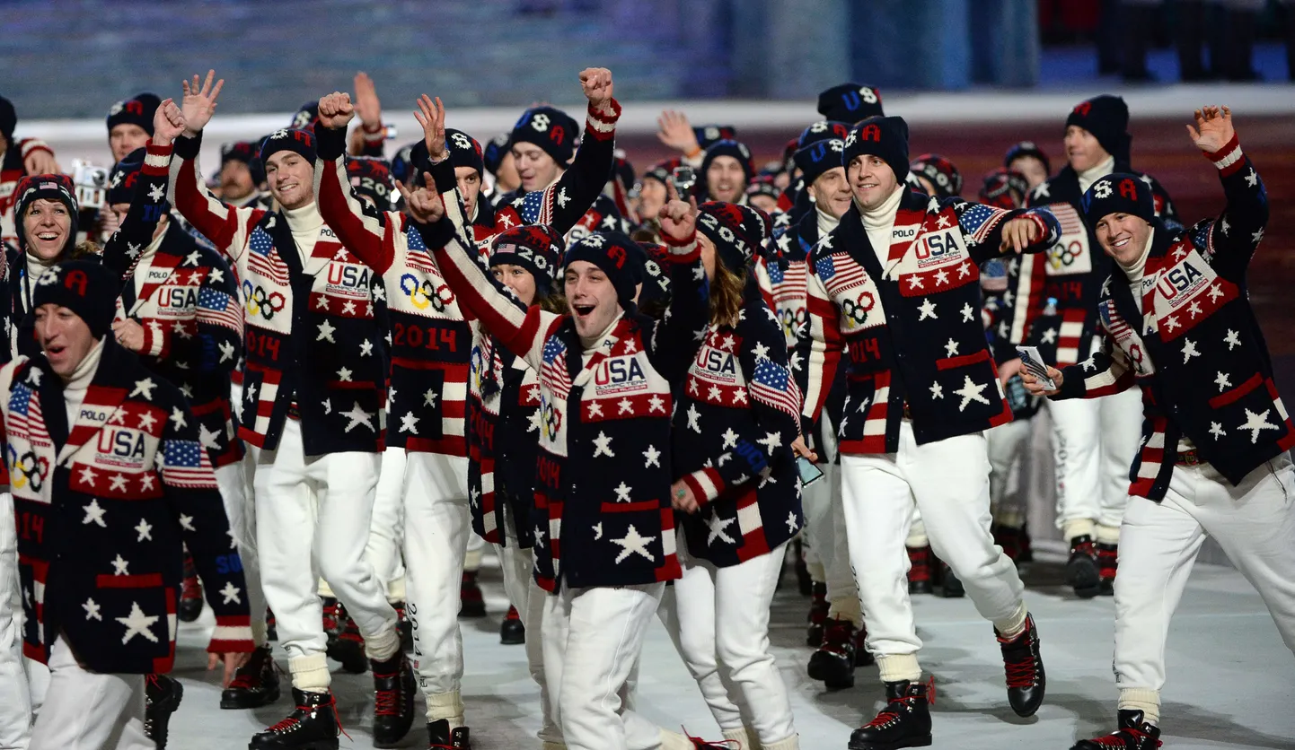 USA's delegation members wave during the Opening Ceremony of the Sochi Winter Olympics at the Fisht Olympic Stadium on February 7, 2014 in Sochi. AFP PHOTO / ANDREJ ISAKOVIC
