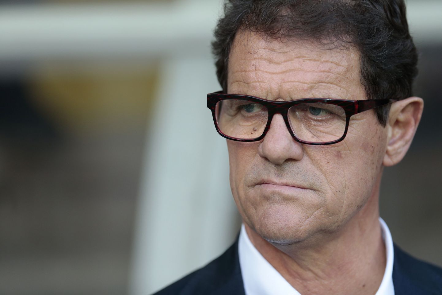 FILE - In this June  14, 2015 file photo, Russias coach Fabio Capello watches his players during the Euro 2016 qualifying soccer match between Russia and Austria, in Moscow, Russia. The Russian Football Union says national team coach Capello has resigned following a dispute over back pay. In a statement released Monday, July 13, 2015, the Russian Football Union did not disclose the financial terms of the settlement but expressed gratitude to Capello for his work. (AP Photo/Ivan Sekretarev, file)