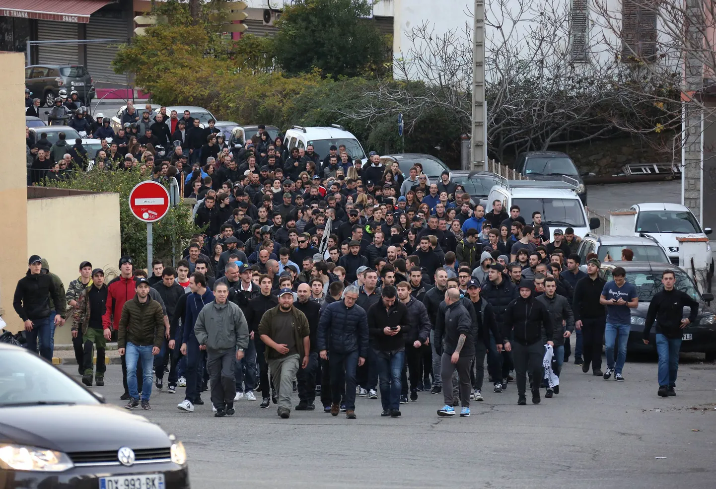 Demonstrators, most of them angry against Muslim residents, march in Ajaccio, on the French Mediterranean island of Corsica, Saturday, Dec. 26, 2015.  A crowd vandalized a Muslim prayer room in Corsica a day after an ambush left firefighters injured on the French island. (AP Photo/Jean-Pierre Belzit)