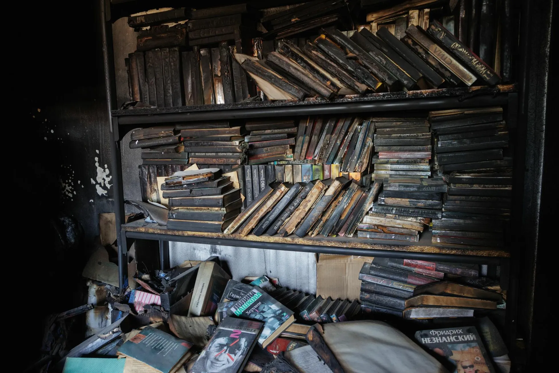 The burned library of the family who lived in Kiryat Shmona, destroyed in Hezbollah's attack.