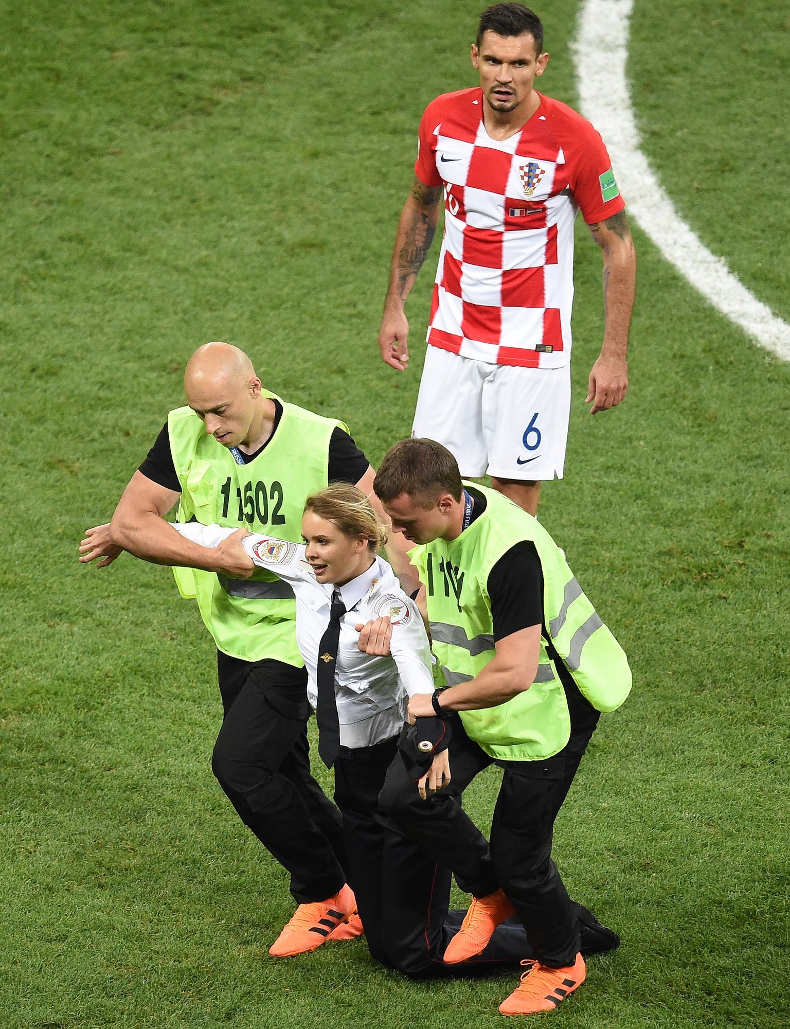 FIFA World Cup Russia 2018. Final. France v Croatia at Luzhniki Stadium. Security take out the member of Russian punk-rock band Pussy Riot during the match. on July 15, 2018 in Moscow, Russia. (Photo by Dmitry Korotaev/Kommersant/Sipa USA)