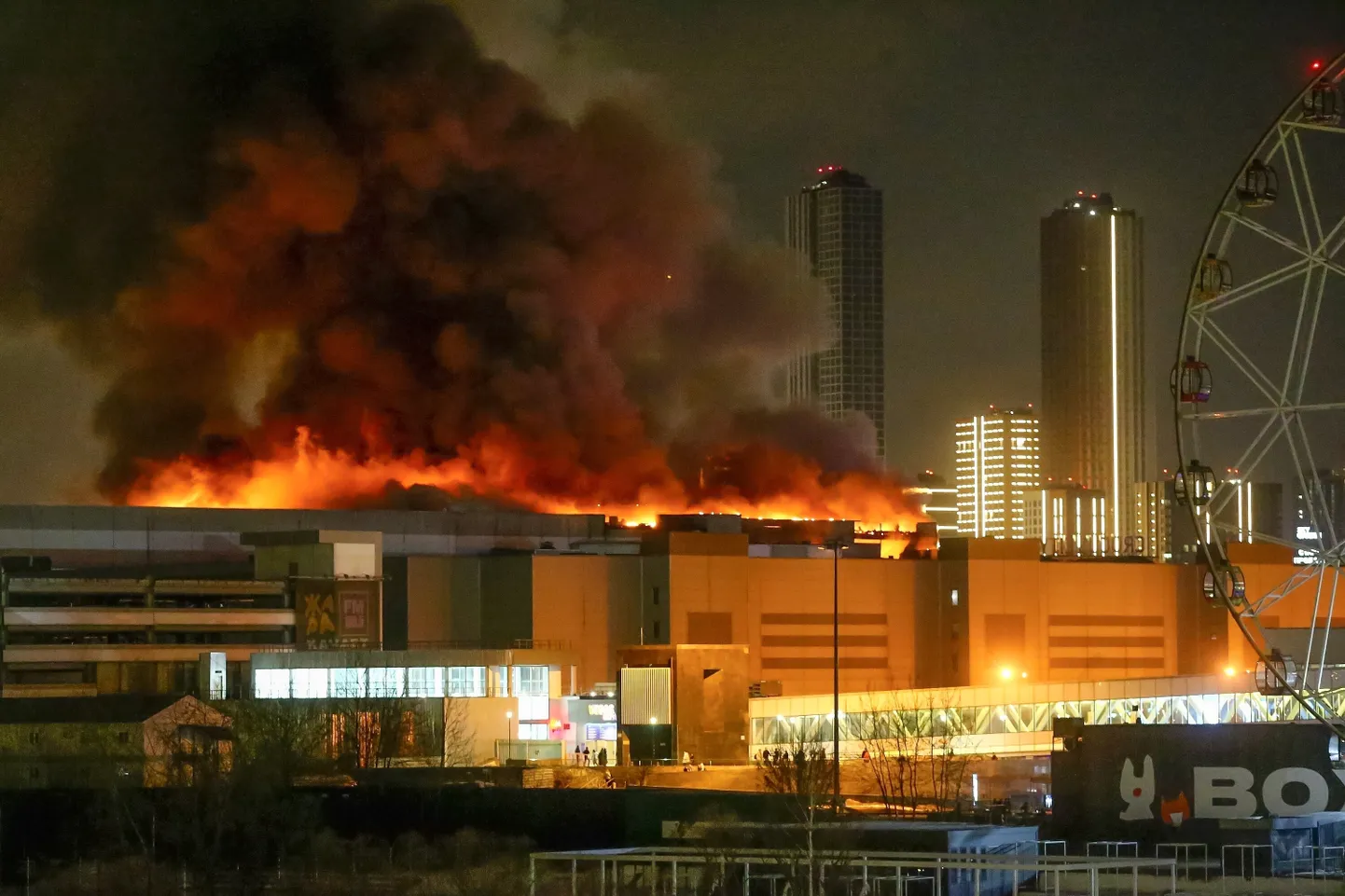 A massive blaze is seen over the Crocus City Hall on the western edge of Moscow, Russia, Friday, March 22, 2024.
