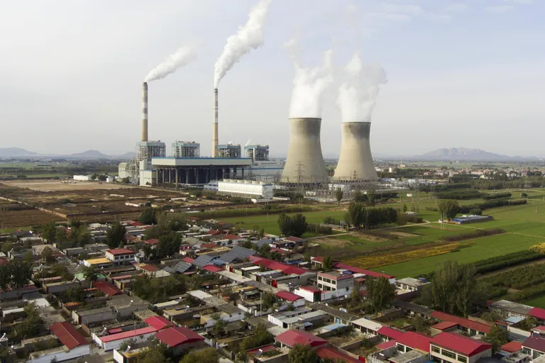 While Europe is racked with guilt over its carbon footprint, China is building new coal-fired power plants at breakneck speed. Pictured: Guohua coal-fired power station in Dingzhou, Baoding, in the Hebei Province of northern China.