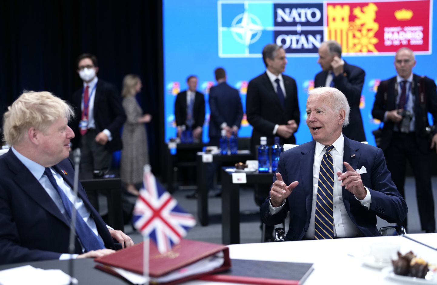 U.S. President Joe Biden, right, speaks with British Prime Minister Boris Johnson during a round table meeting at a NATO summit in Madrid, Spain on Thursday, June 30, 2022.