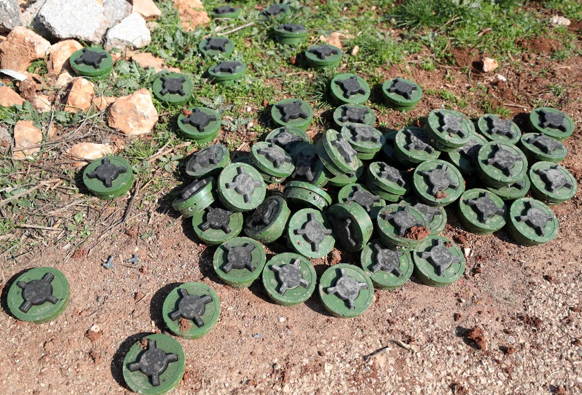 A picture taken on February 25, 2020 shows defused Russian anti-personnel mines in the village of al-Nayrab, about 14 kilometres southeast of the city of Idlib in northwestern Syria, after Turkish-backed rebels seized the village from regime forces.