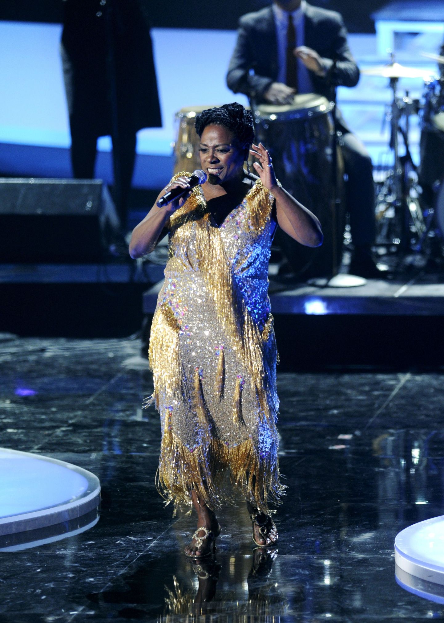 FILE - In this Dec. 18, 2011 file photo, Sharon Jones & the Dap-Kings perform onstage at the "Vh1 Divas Celebrates Soul," in New York. Jones, a big-voiced soul singer who performed with high energy onstage has died at age 60 in New York, after battling pancreatic cancer. Her representative Judy Miller Silverman says she died Friday, Nov. 18, 2016, at a Cooperstown hospital surrounded by her band, the Dap-Kings. (AP Photo/Evan Agostini, File)