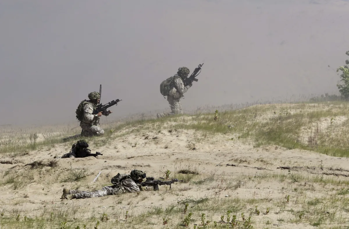 Latvian soldiers conducting tactical exercises.