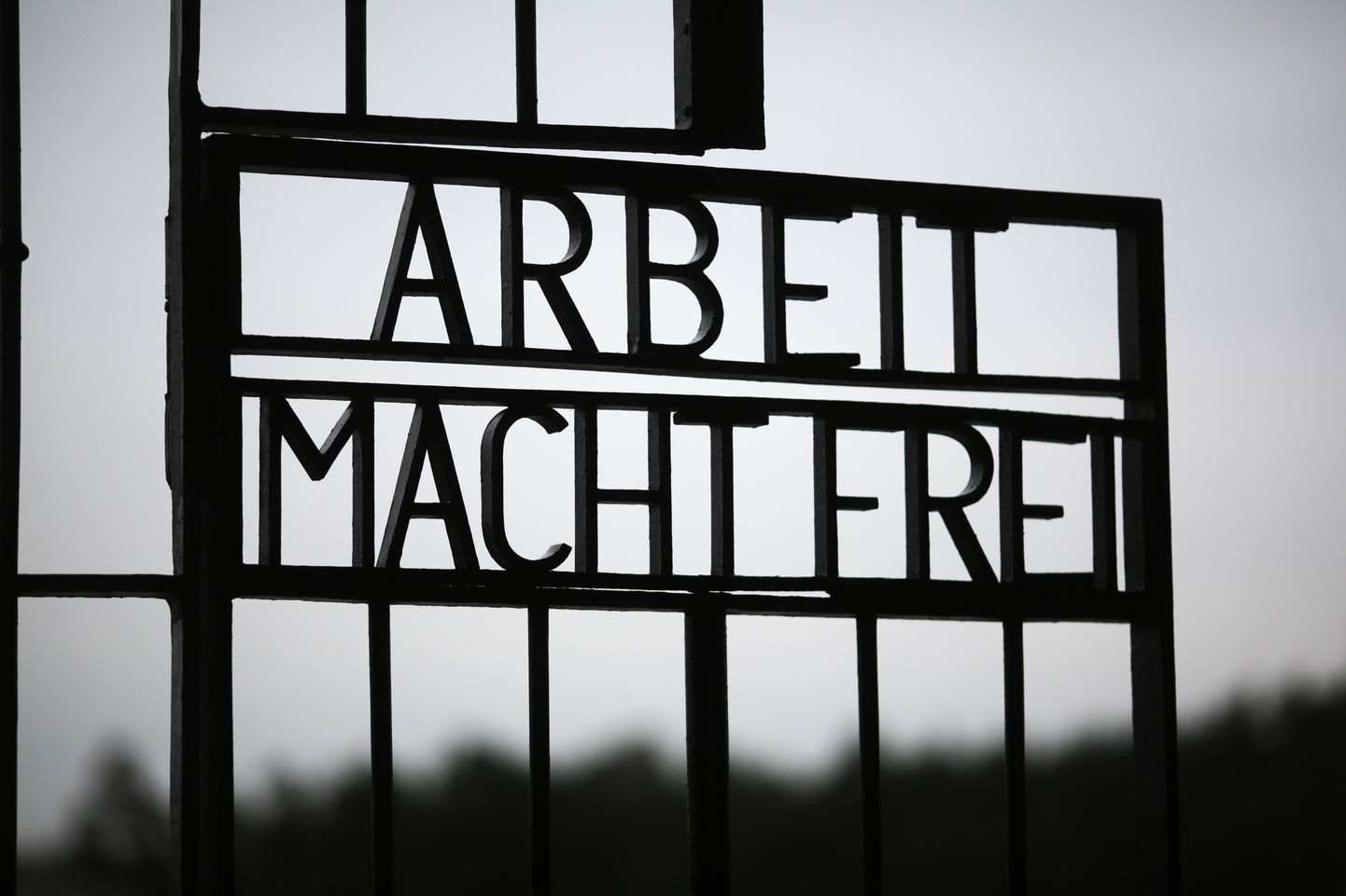 The gate of the Sachsenhausen Nazi death camp with the phrase 'Arbeit macht frei' (work sets you free) photographed on  the International Holocaust Remembrance Day, in Oranienburg, about 30 kilometers, (18 miles) north of Berlin, Wednesday, Jan. 27, 2016. The International Holocaust Remembrance Day marks the liberation of the Auschwitz Nazi death camp on Jan. 27, 1945. (AP Photo/Markus Schreiber)