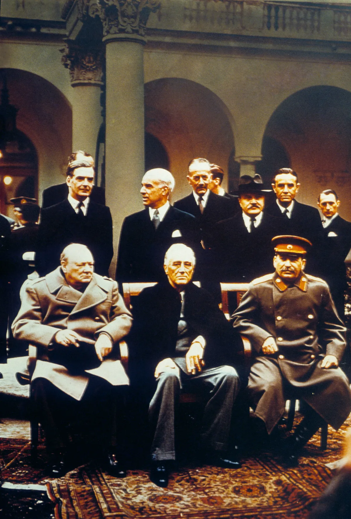 YALTA CONFERENCE, 1945. Winston Churchill , Franklin D. Roosevelt and Joseph Stalin at the Yalta Conference at Livadia Palace, Yalta , Crimea. Standing left to right: Anthony Eden, Edward Stettinius, Alexander Cadogan, Vyacheslav Molotov and W. Averell Harriman.